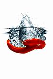 Red hot chili peppers dropped into water