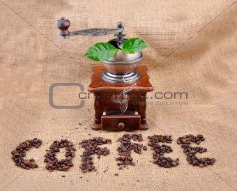 vintage coffee grinder and sign coffe from coffee granules