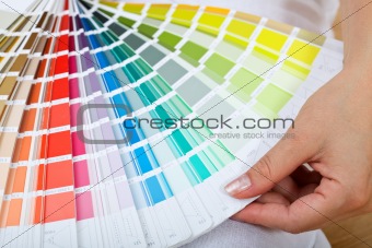 Woman hand with color sample