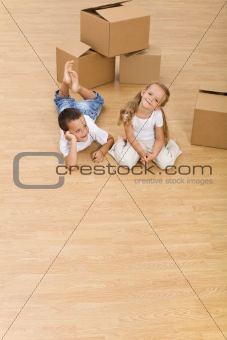 Kids on the floor in their new home
