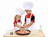 Kids preparing a pizza