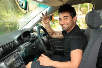 Happy male driver holding car keys