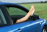 woman's legs in a car