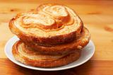 Palmier pastries on white saucer