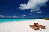 canvas chairs on tropical beach