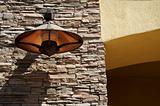 Abstract Slate Rock & Stucco Wall with Copper Lamp