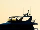 Motor boat in sunset