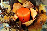 Christmas composition with leafs and candle