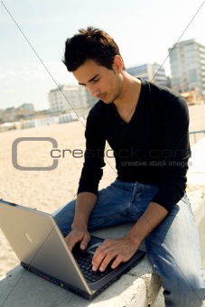 Man using computer outdoor