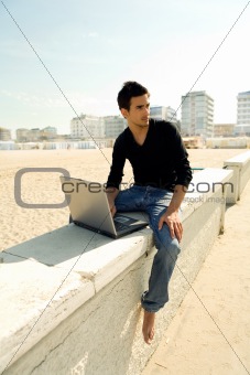 Attractive man with laptop outdoor