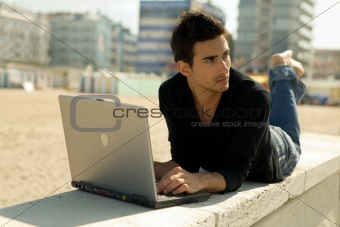 Man with computer working outdoor