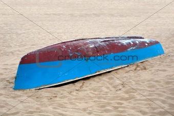 a boat lying on a beach in spain