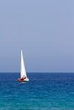 sail boat cruising the coast of corsica