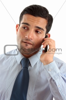 Businessman on mobile phone thinking