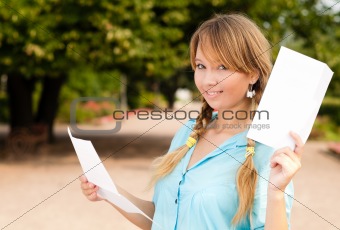 beautiful young student girl with letter