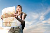 young woman with map and backpack