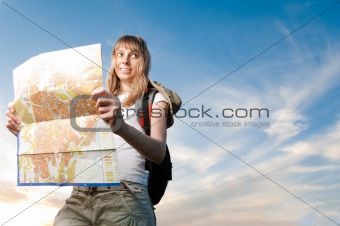 young woman with map and backpack