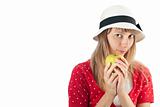 woman in hat holding apple