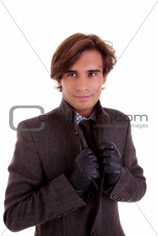 Portrait of a young businessman, in autumn/winter clothes, isolated on white. Studio shot