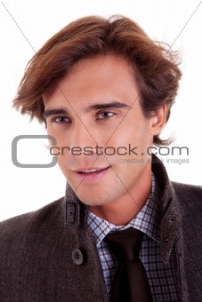 Portrait of a young businessman, in autumn/winter clothes, isolated on white. Studio shot