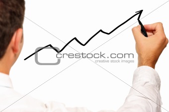 Businessman drawing a graph