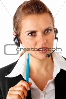 thoughtful  modern business woman with headset
