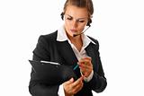worried modern business woman with headset and clipboard
