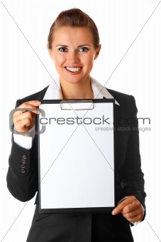 smiling modern business woman holding blank clipboard

