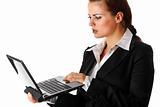  thoughtful modern business woman  looks in laptops screen
