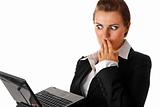  modern business woman amazedly looks in laptops screen
