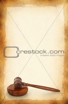 wooden gavel against old dirty background