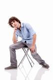 young man, sitting on a bench, isolated on white  background