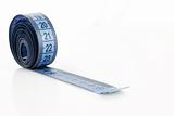 Twisted blue measuring  tape isolated on white