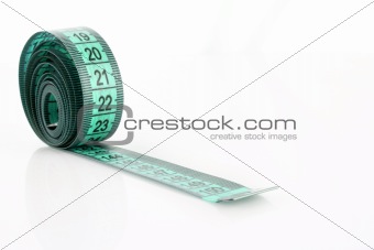 Twisted blue measuring  tape isolated on white
