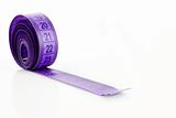 Twisted purple measuring  tape isolated on white