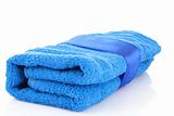 Folded blue towel with the band isolated on white