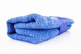 Folded blue towel with the band isolated on white