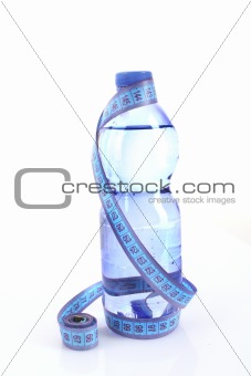 Sparkling water with measuring tape isolated on white