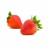two strawberries on white background