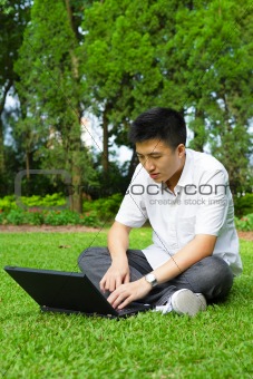 man using computer outdoor