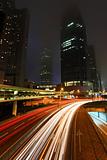Blurs of night city traffic streams