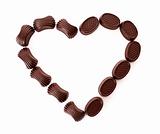 Chocolates in love shape isolated on white