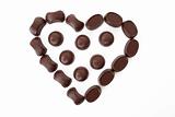 Chocolates in love shape isolated on white