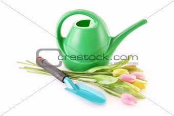 Bailer with flower and shovel isolated on white