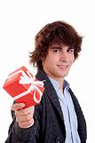 happy young man, with a red gift isolated on white background, studio shot.