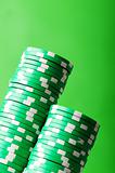 Stack of casino chips against green background