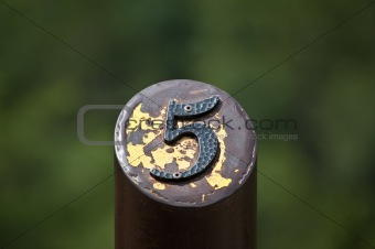 Number 5 on a Metal Post