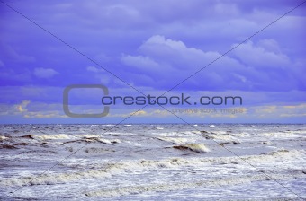 Dark stormy sky over the wave ocean