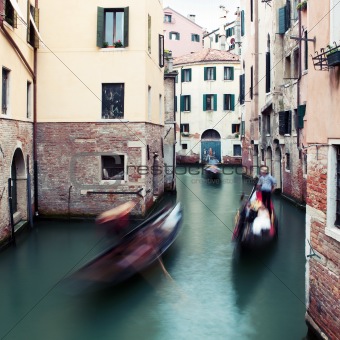 Motion-blurred traditional "gondola" boats in Venice, Italy
