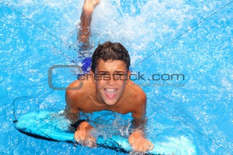 boy teenager surfboard splashing blue water